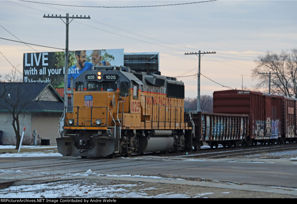 UP 1025 follows a gondola, three boxcars and sister 1145 toward Five Points and the UP yard